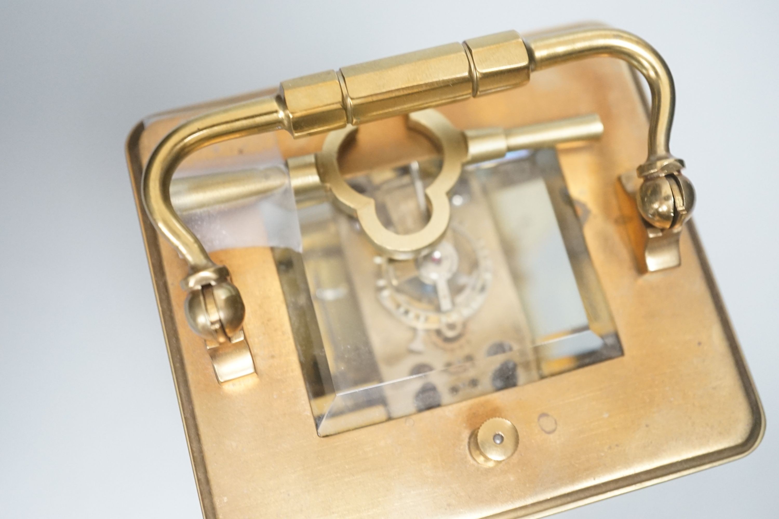 A brass repeating carriage clock, 13cm with key